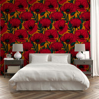 Red poppies pattern on vibrant orange wallpaper backdrop

