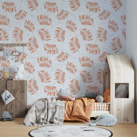 Mural wallpaper featuring tossed palm leaves

