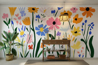 Close-up of cut-out floral forms in bright mural colors

