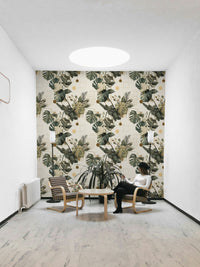 Palm and monstera motifs with hexagonal outlines on wallpaper

