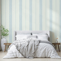 Linen-textured wallpaper with light blue boho stripes.

