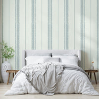Neutral-toned striped wall mural with soft blue

