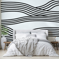 Entryway wall with black and white wave design

