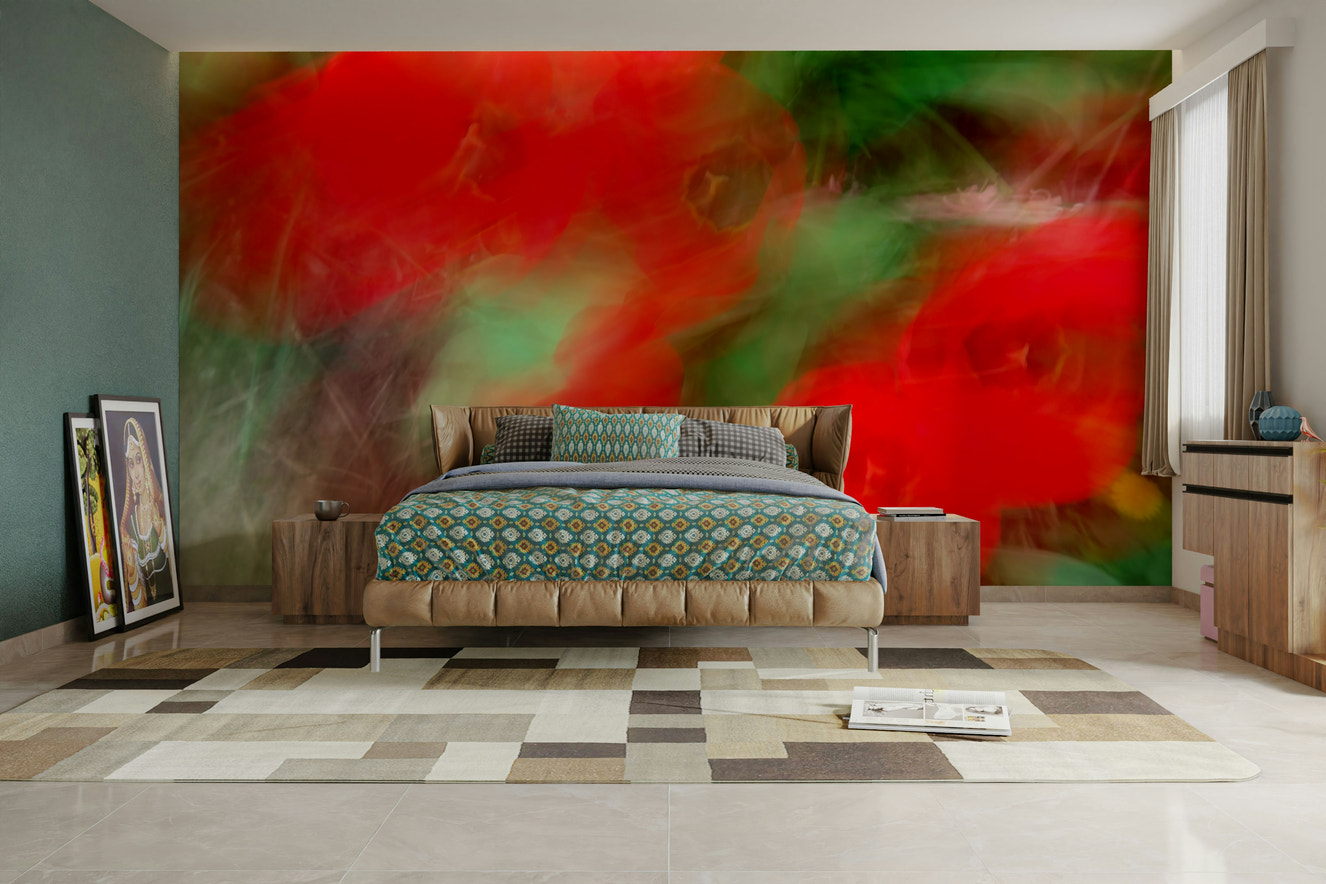An abstract wall mural showing a floral design with vibrant red and green colors.

