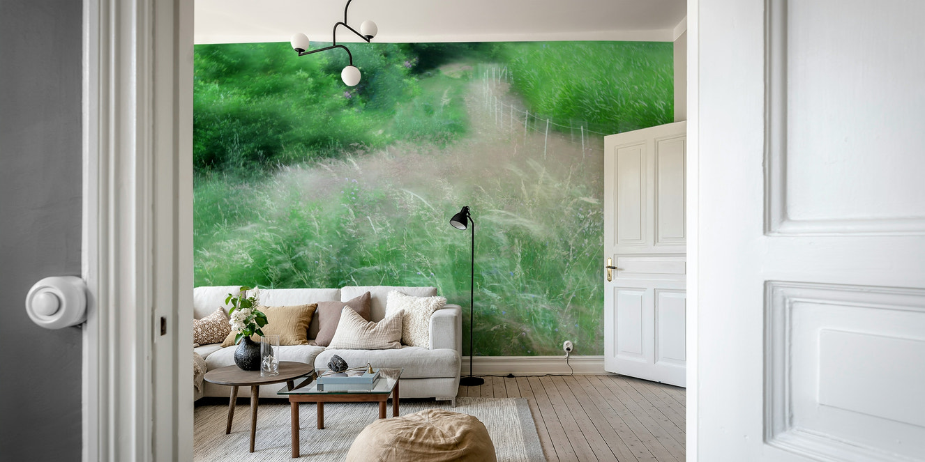 An abstract wall mural of a blurry, lush green pathway.