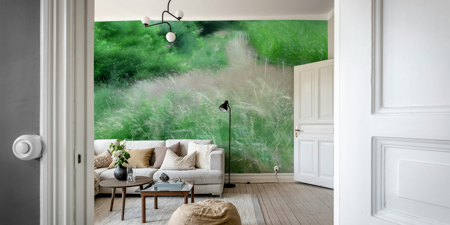 An abstract wall mural of a blurry, lush green pathway.