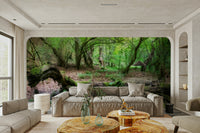 A wall mural of a lush green forest.

