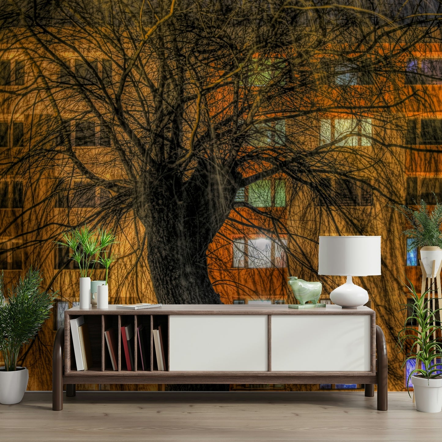 Vibrant city lights and dark tree form.

