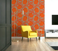 Accent wall with coral botanical wallpaper
