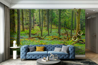 Light-filled forest design on wall.

