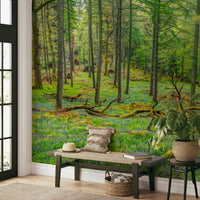 Bedroom with woodland wall decor.

