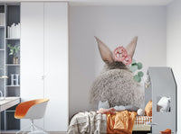 Focus on the bunny's fluffy tail and floral details.

