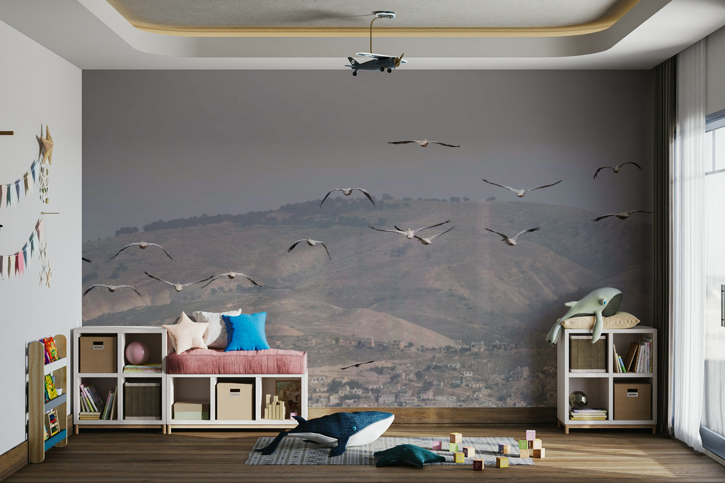 Birds are depicted soaring or flying in the sky above the hills.
