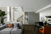 The design has a retro, 1970s floral style.

