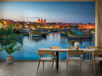 A wall mural featuring a Mediterranean fishing harbor.

