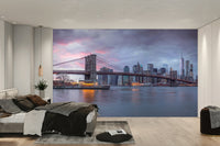 A wall mural featuring a city skyline at dusk.

