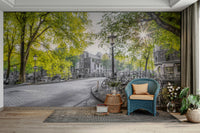 The buildings and street are mostly black and white.

