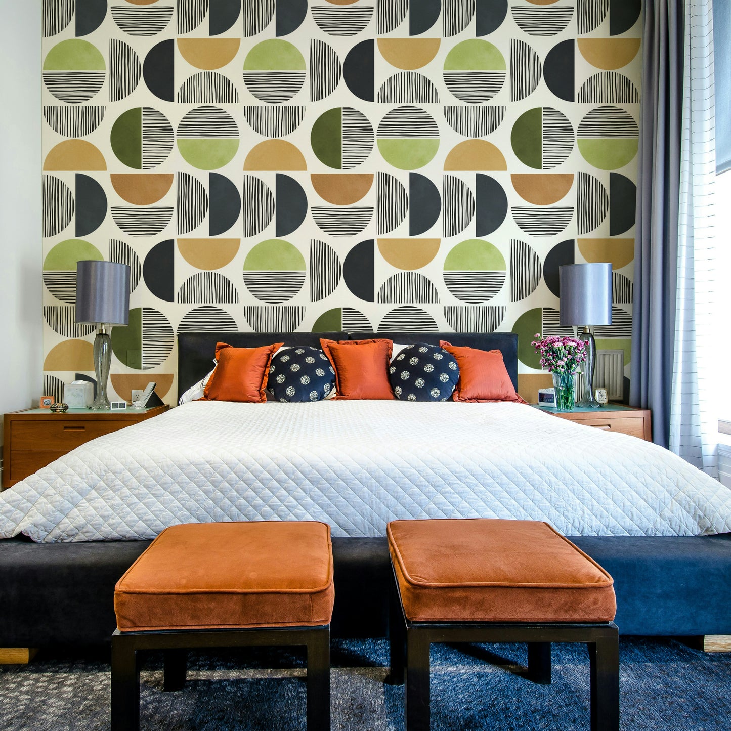 The design suggests a sun and a landscape.

