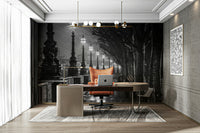 A black and white photo of a walkway at night.

