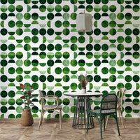 The colors are soft, muted tones of deep greens, emeralds, and olives.

