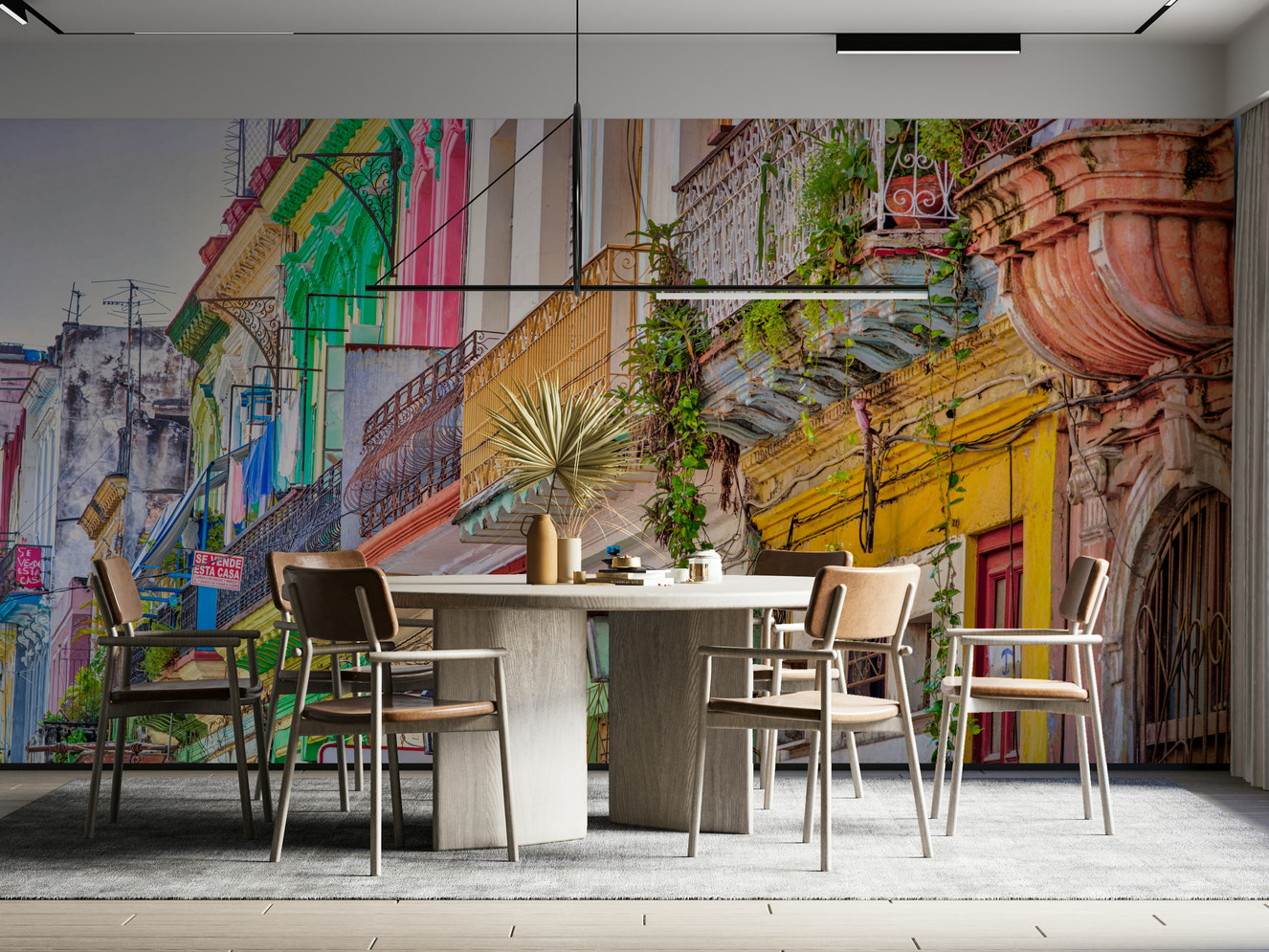 A wall mural of a vibrant street scene in Cuba.

