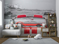 The background is a black and white image of a coastline.

