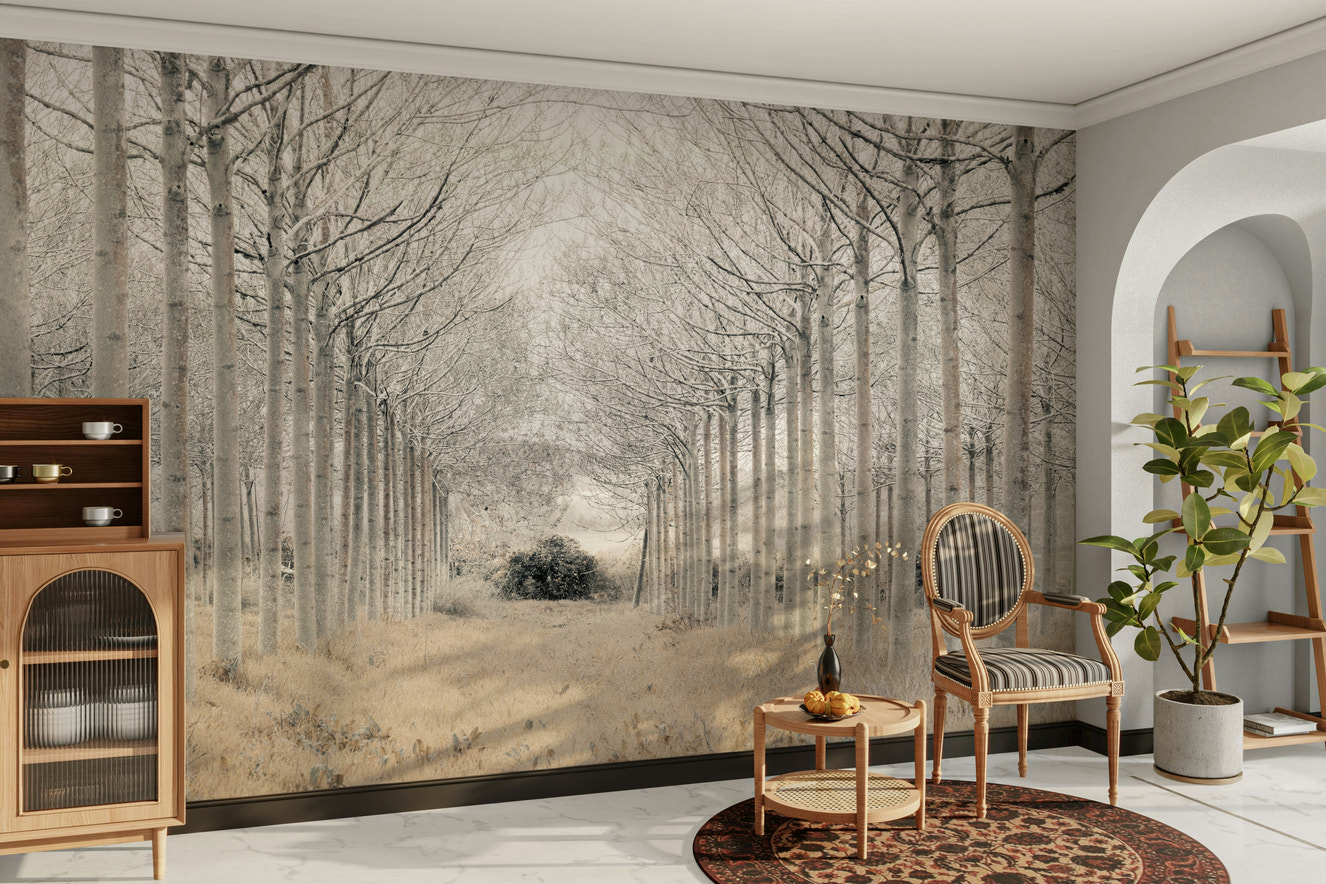 A wall mural of a snowy landscape with an alley of trees.

