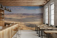 The colors are muted tones of brown, tan, and blue.

