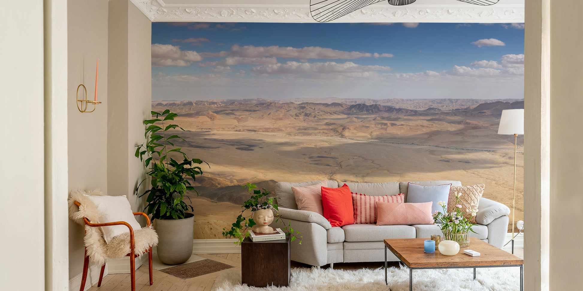 The image shows a vast landscape of sand and rock.

