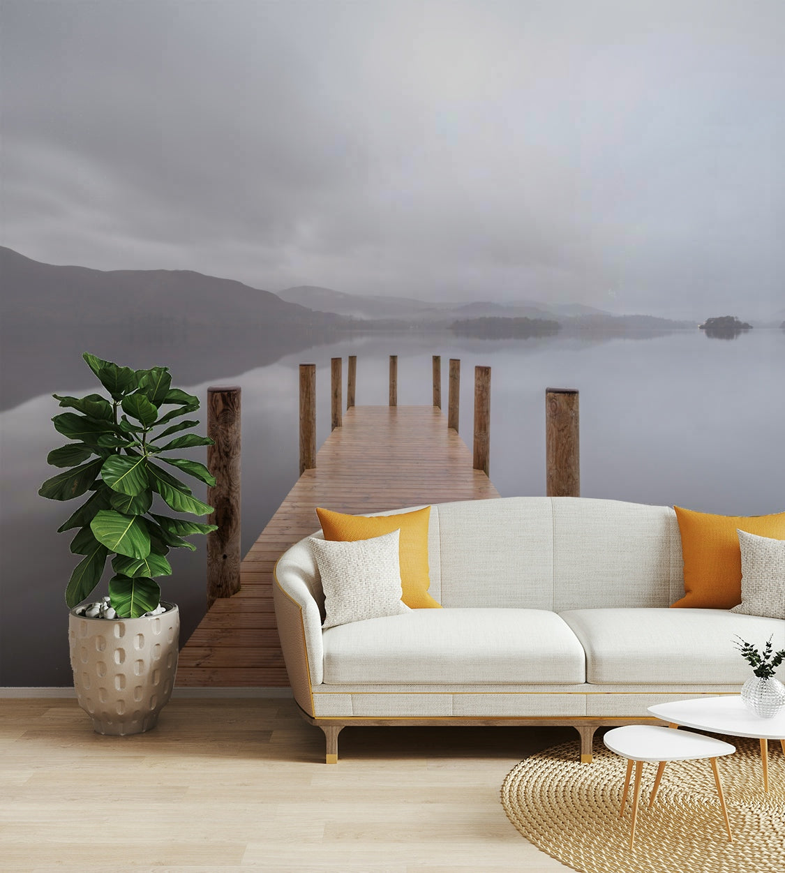 The image shows a calm lake surrounded by hills and mountains.

