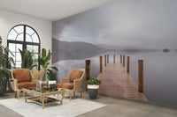 The colors are muted tones of gray, green, and brown.

