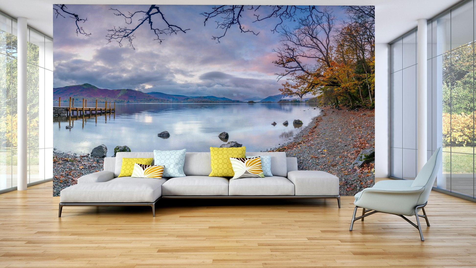 The image shows a calm lake surrounded by hills and mountains.

