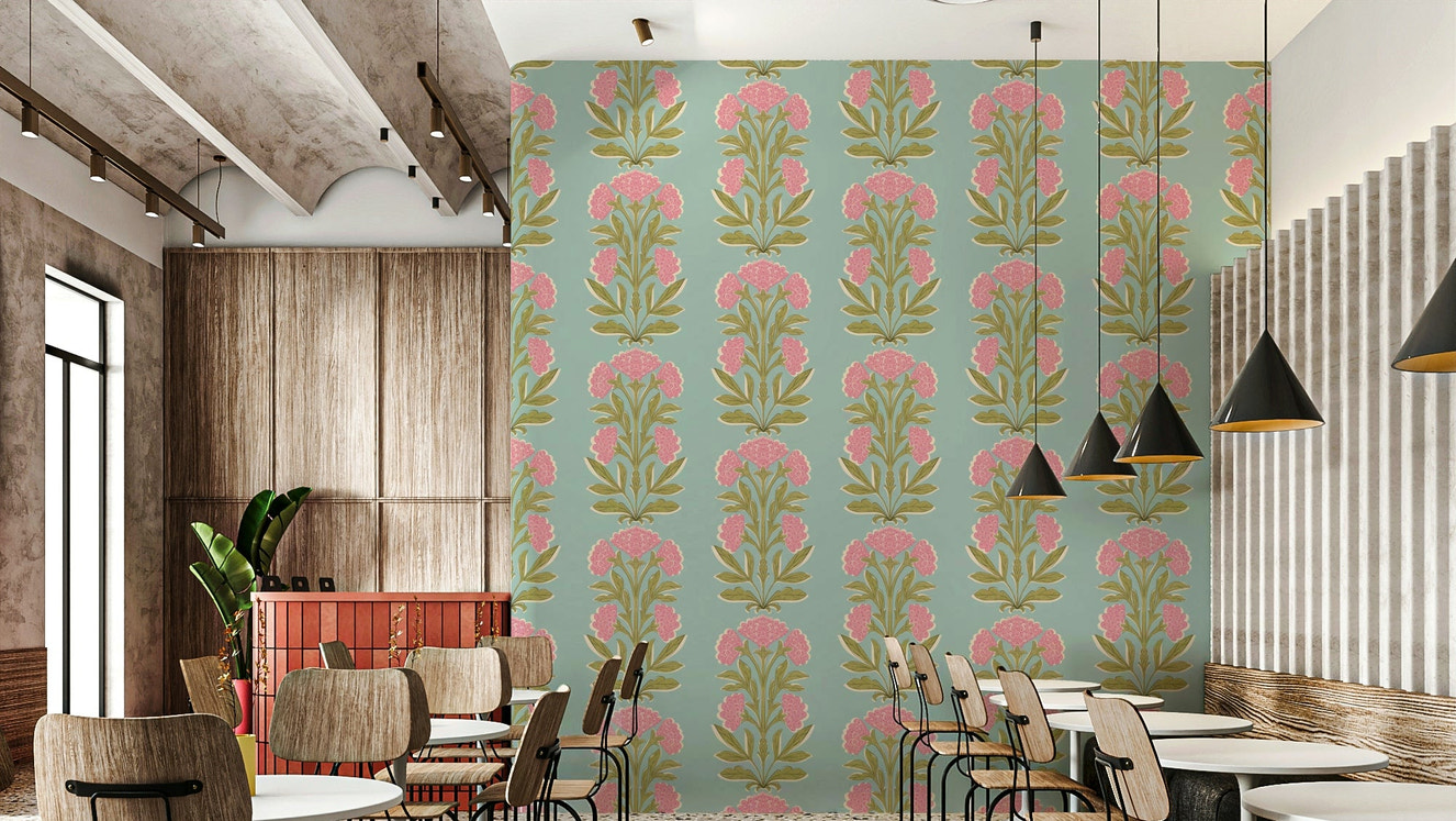 A wall mural of a symmetrical floral and leaf pattern.

