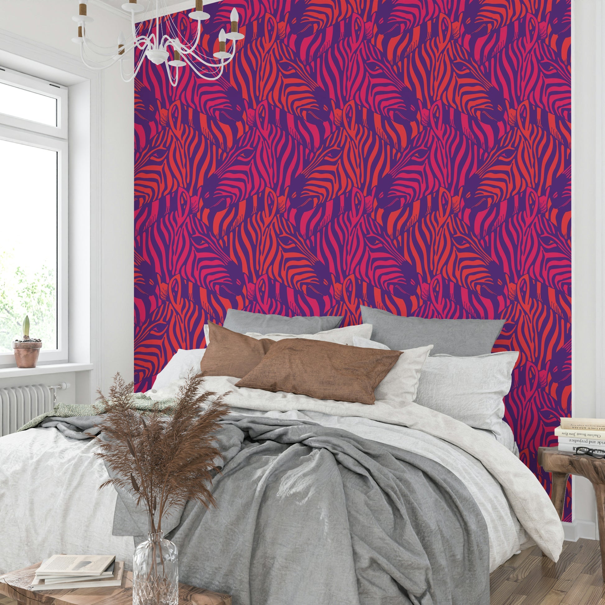 A wall mural of a zebra herd with artistic stripes.

