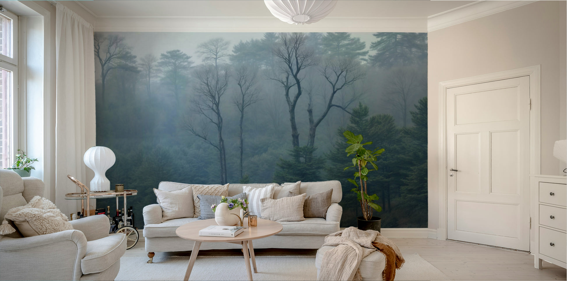 A wall mural of a peaceful forest and misty lake.

