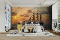 A wall mural of a sailboat at dusk.


