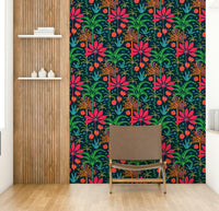 The mural is installed in a cheerful living room behind a simple, light-colored sofa.

