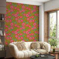 The image shows a full wall with a pattern of large flowers and leaves.

