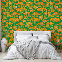 The image shows a full wall with a pattern of wild roses and leaves.

