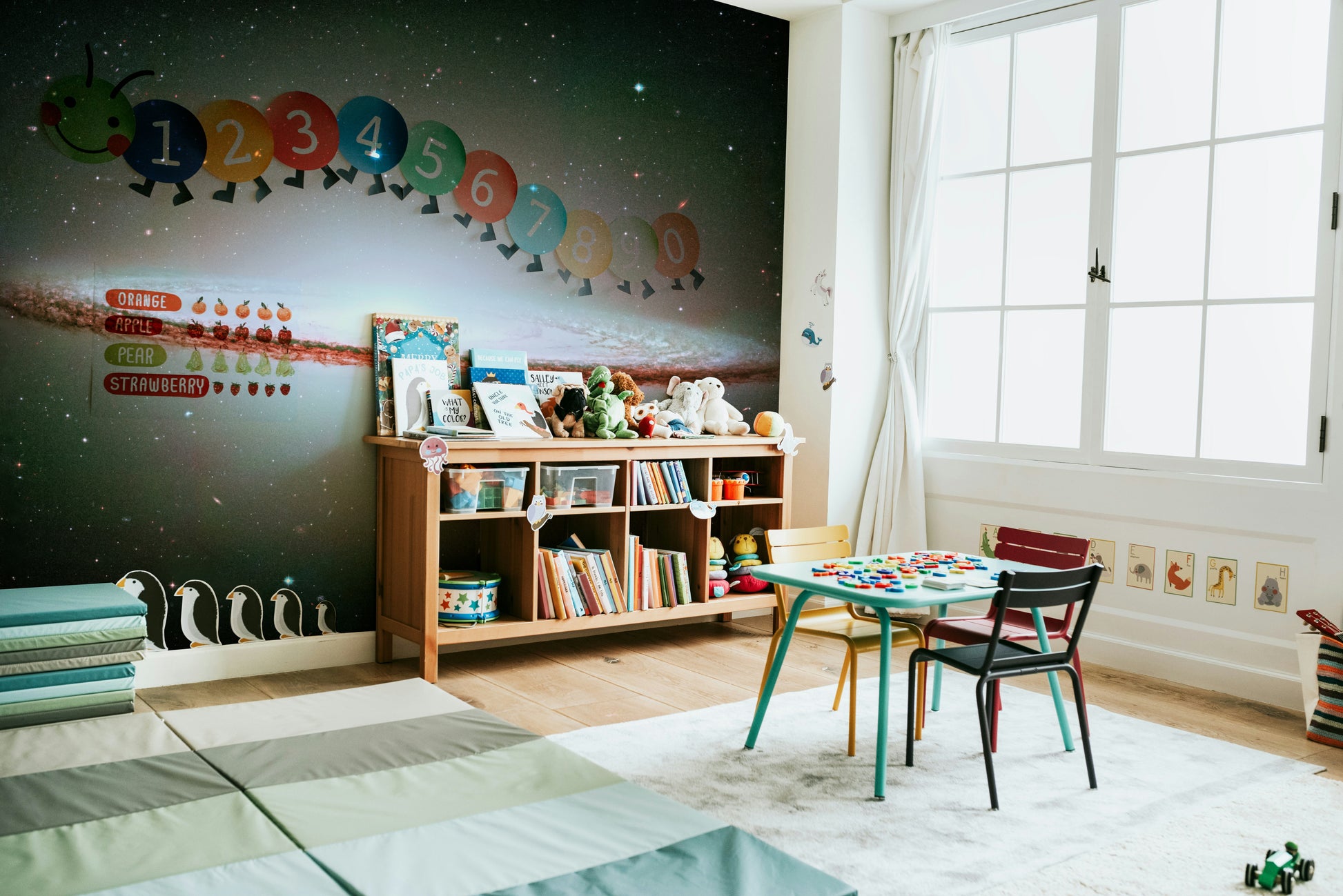 The colors are soft, muted tones of blue, purple, and gold.

