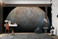 The mural gives the illusion of a window looking out into the cosmos.
