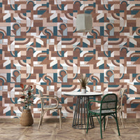 The mural is installed in a calm living room behind a simple, light-colored sofa.

