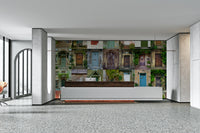 Plants and flowers are growing near the doors.

