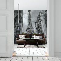 The composition is centered on the tower, framed by buildings.

