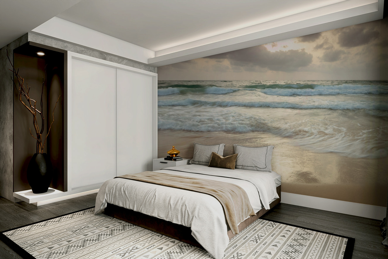 A peaceful wall mural with a tranquil beach scene.

