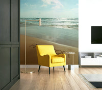 The colors are natural and light, with blues, whites, and beige sand.

