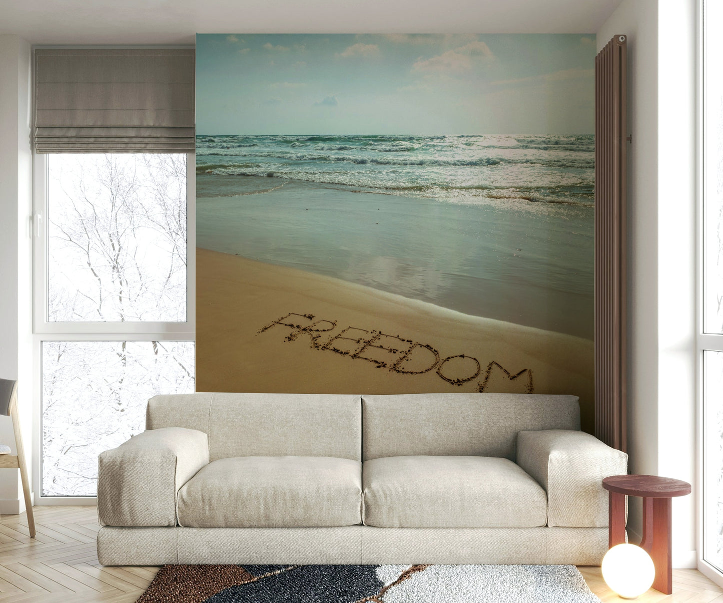 The word "FREEDOM" is written in the sand.

