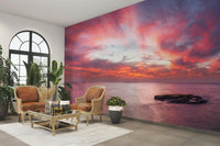 The colors are soft and dreamy, with shades of pink, orange, and light blue.

