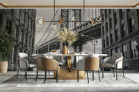 The view is from a cobblestone street in a city neighborhood.

