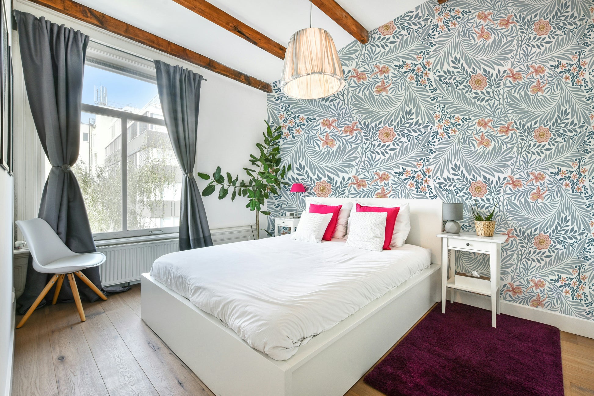 The image shows a repeating design with larkspur flowers and leaves.

